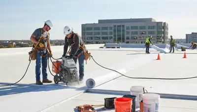Commercial roofing team installing durable roof in Pittsburgh, PA for local business protection