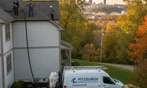 Gutter cleaning for tree-covered Pittsburgh, PA homes by vinyl siding professionals