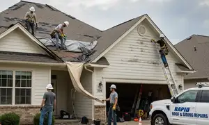 Roof repair after storm damage in Pittsburgh, PA for a vinyl siding and exterior home service business
